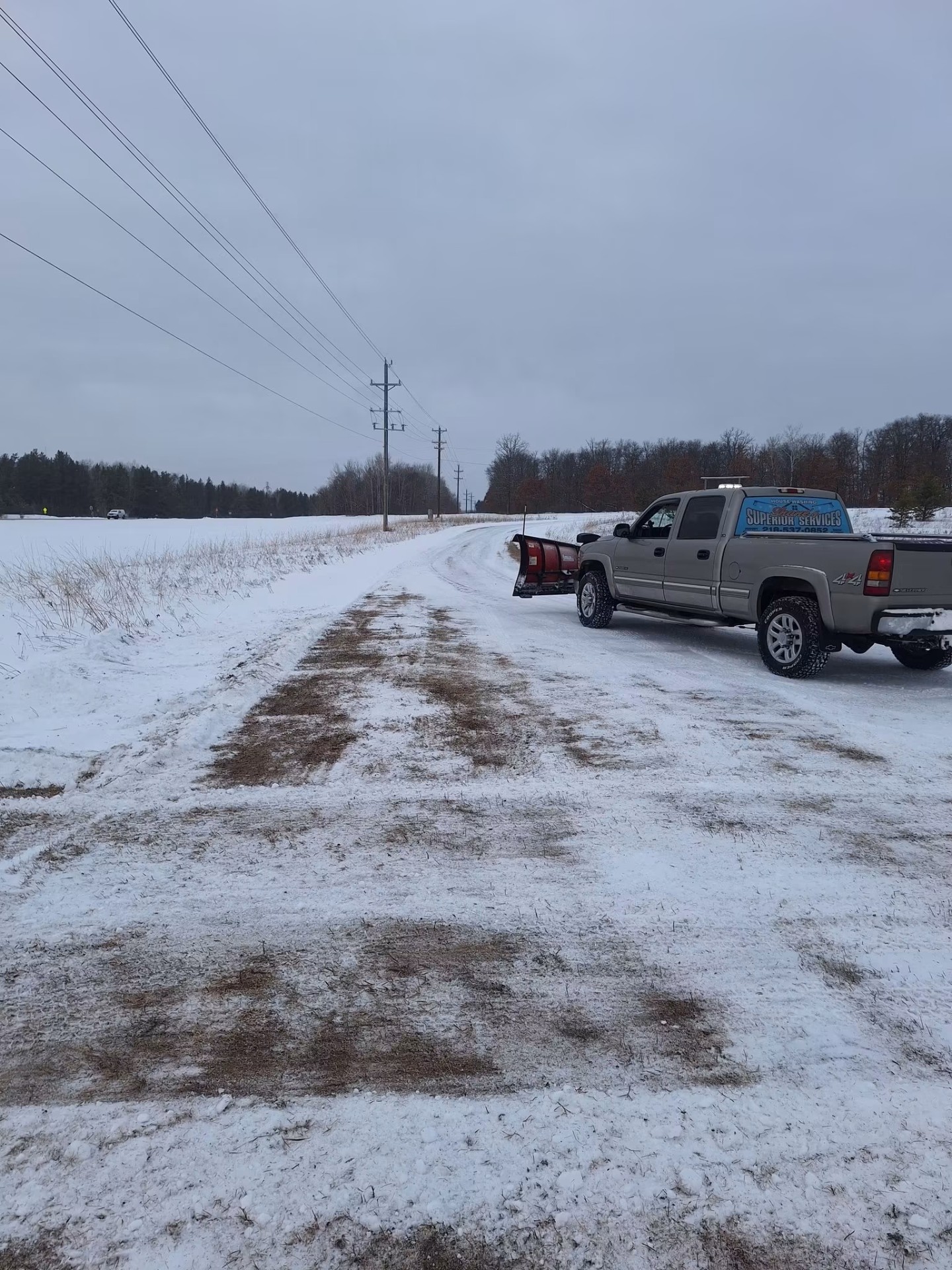 Shane's Superior Services plow truck clearing a rural road