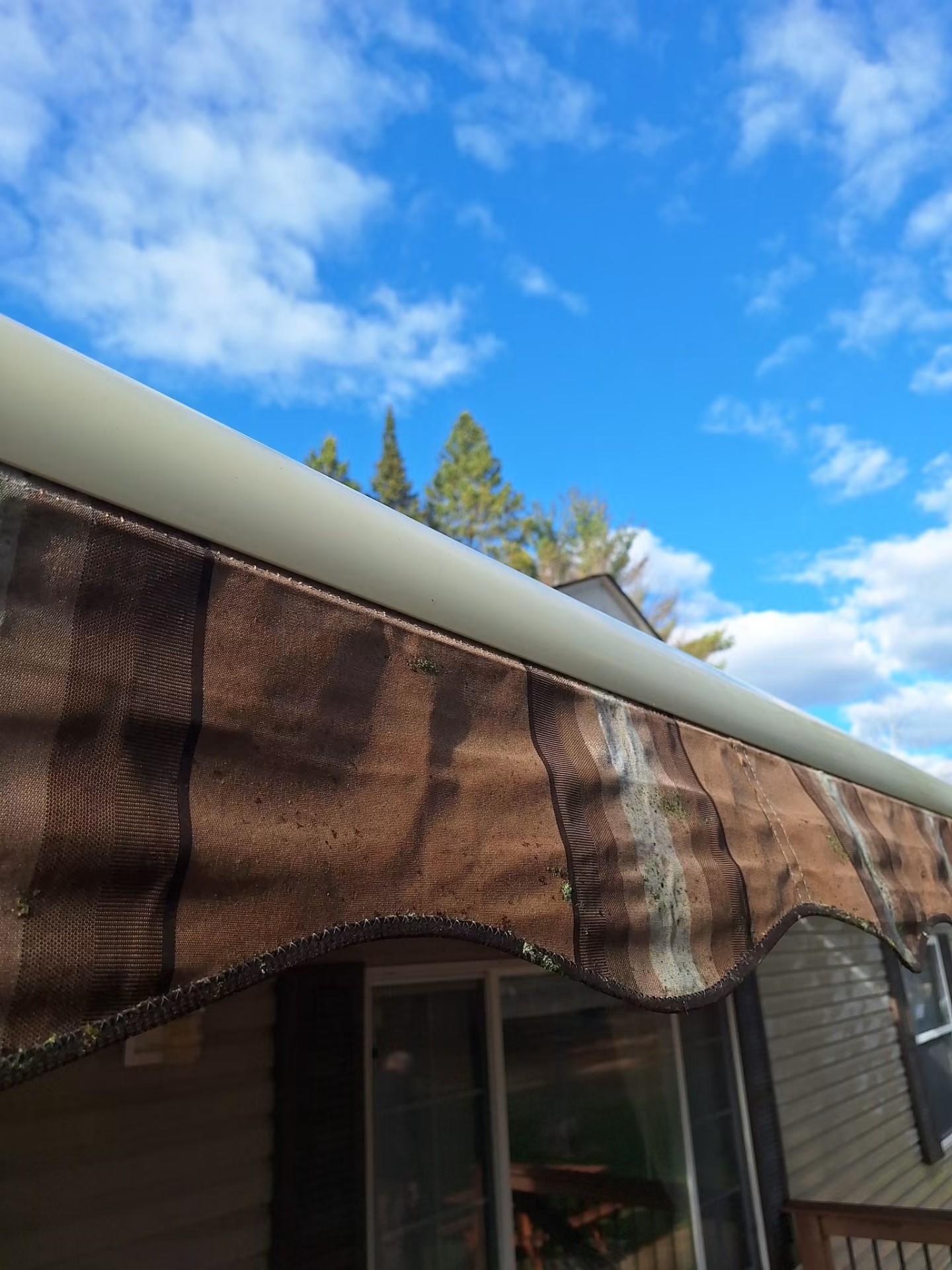 Deck awning treated and cleared of moss and mildew