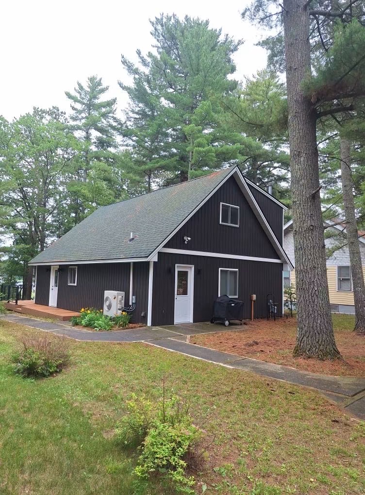 Dark-sided cabin cleaned and cared for in the pines